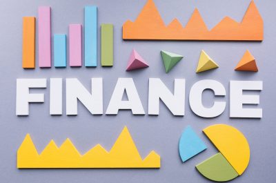 finance-word-surrounded-by-many-graphs-grey-background